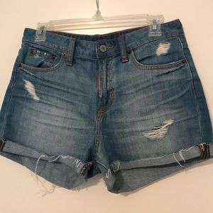 Distressed blue jean shorts